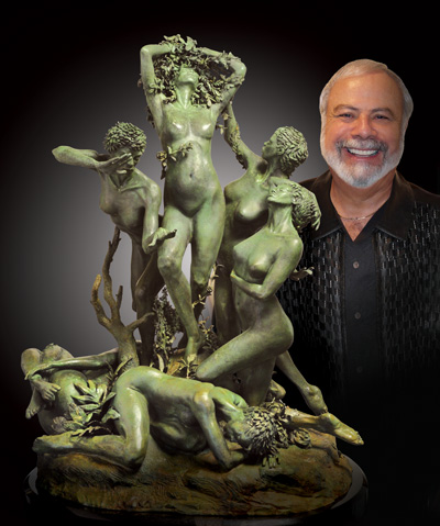 Leon Richman standing next to sculpture